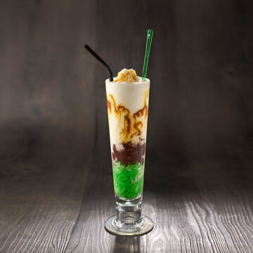 Cendol Sling shake with straw served in glass isolated on table side view healthy morning drink