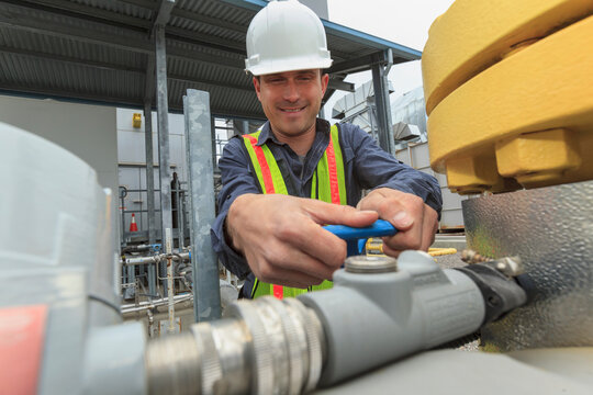 Industrial engineer checking valve closure at a power plant