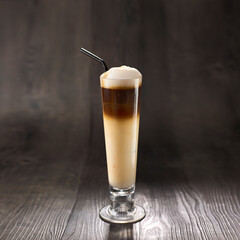 Kopi Cino or cappucino with straw served in glass isolated on table side view healthy morning drink