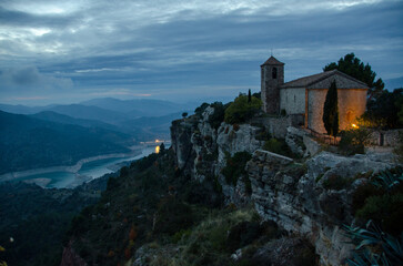 Old village on top of a mountains at sunset in Spain