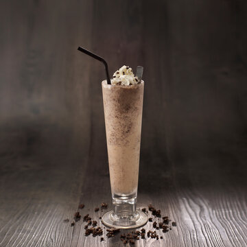 Oreo Crush Milkshake with straw served in glass isolated on table side view healthy morning drink