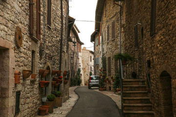 Fototapeta na wymiar Narrow street in stone village in Italy