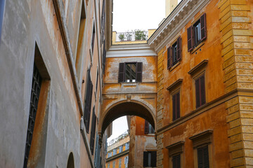 Narrow street with arch in Italy