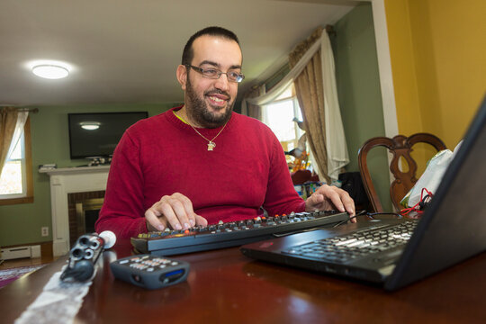 Man with Visual Impairment at his keyboard using a screen reader