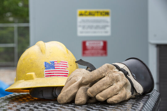 Hard hat with rubber protective gloves