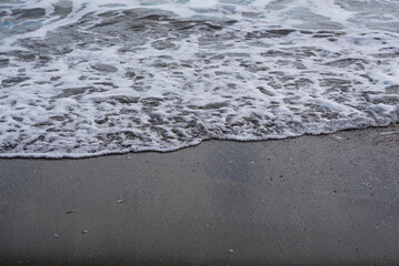 Sea foam on the shore