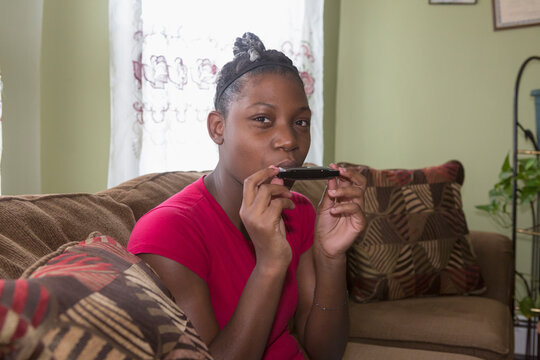 Teen suffering from Bipolar Disorder playing the harmonica