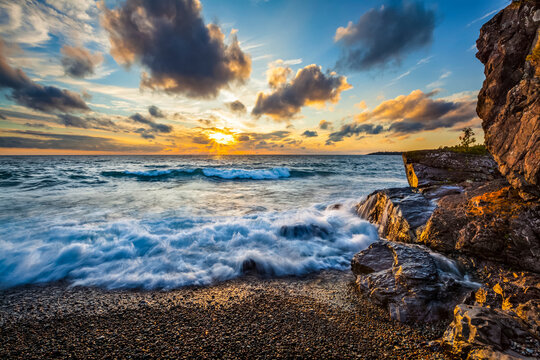 Surf Washes On Shore As The Sun Sets Over Lake Superior; Ontario, Canada