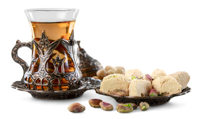 Bronze plate with arabian sweets and tea. Ramadan Kareem.