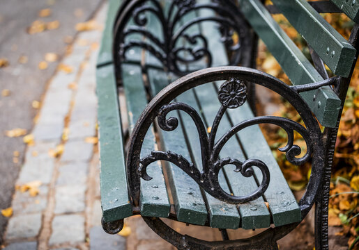 Decorative features on the arm rest of a park bench in Central Park, Manhattan; New York City, New York, United States of America