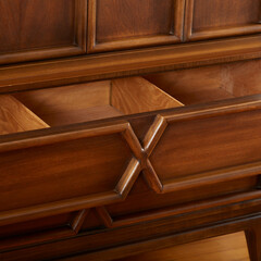 Wooden chest, mid-century modern wardrobe. Unique sculpural design. Close-up drawer detail view.