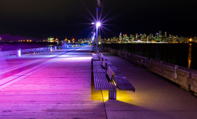Lonsdale Quay illuminated with colourful lights at night; North Vancouver, British Columbia, Canada