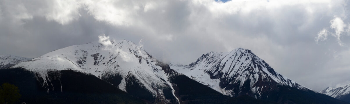 Rugged peak of Hudson Bay Mountain covered in snow; Smithers, British Columbia, Canada