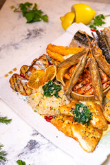 a set of different fish dishes on a white plate