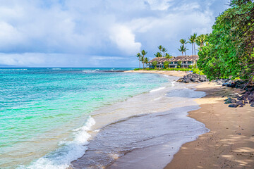 Surf rolling onto the shore at a beach resort in Lahaina; Maui, Hawaii, United States of America