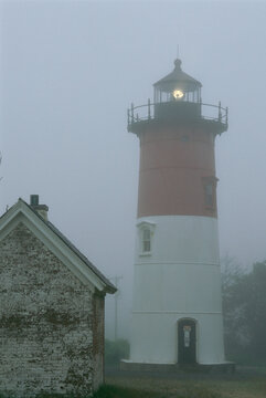 Nauset lighthouse on a foggy morning.; Nauset Lighthouse, Eastham, Cape Cod, Massachusetts.
