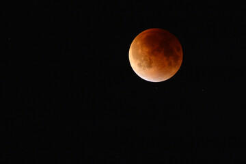 Total lunar eclipse also known as a blood moon.; Arlington, Massachusetts, USA.