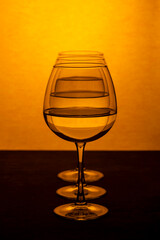 Still life with three glasses of clear liquid