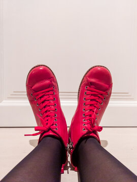 Close-up Of Red Womens Shoes With Black Stockings Against White Door. Image Taken Indoor In Olen, Belgium, December. 