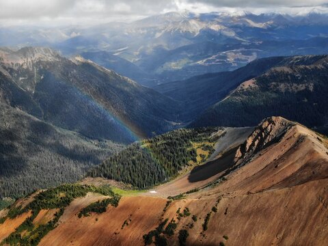 Aerial of rainbow in Chilcotin Mountains British Columbia