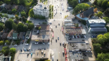 Tuinposter Aerial view overhead of Bloor Street West in western Toronto, Ontario, Canada looking west during late summer afternoon. © Atomazul