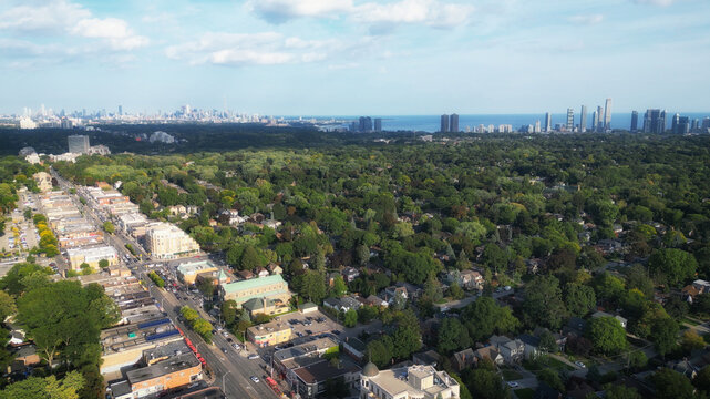 Aerial view over Bloor Street West in the Kingsway neighborhood of Toronto, Ontario, Canada. Looking southeast towards the downtown core Toronto skyline, Mimico and Lake Ontario.