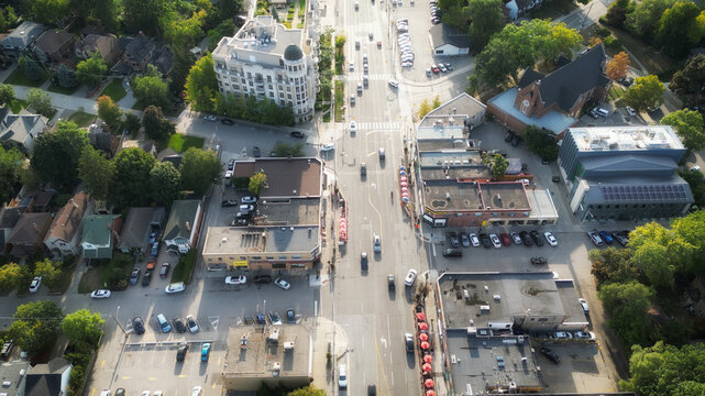 Aerial view overhead of Bloor Street West in western Toronto, Ontario, Canada looking west during late summer afternoon.
