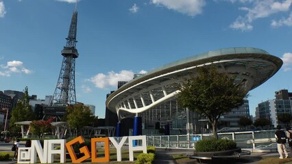 NAOGYA, JAPAN - OCTOBER 2022 : View of HISAYA ODORI PARK and SAKAE area in sunny daytime. Busy central downtown area in Nagoya city. Time lapse shot. Travel and tourism concept video.