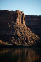 Sun set on red sanstone canyon wall on the Green River in Utah