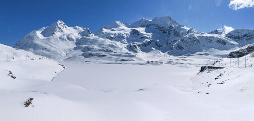 Fototapeta na wymiar Panorama of snowy climbed