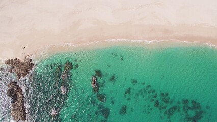 Top down aerial of clear blue water in Cabo, Mexico