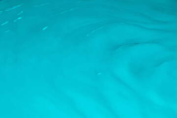 Blue liquid, waves, fluidity.