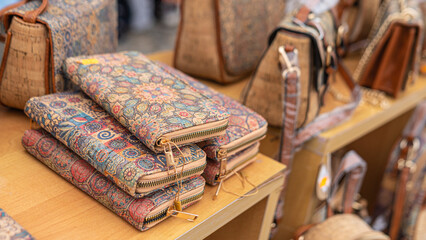Portuguese souvenirs, brown cork bags, at the street market at the Nazare, Portugal.