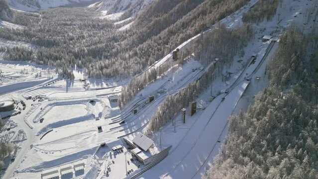 Ski Jump in Planica near Kranjska Gora Slovenia covered in snow at winter time, aerial view.