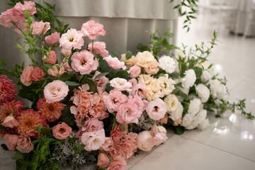 Main table at a wedding reception with beautiful fresh flowers and candles.