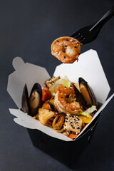 Delicious wok noodles box container. Chinese and asian takeaway fast food.