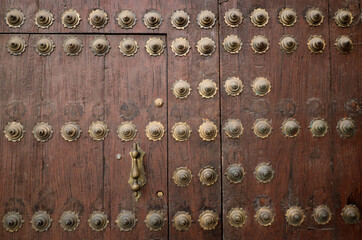 Detail of medieval doors with modern lock