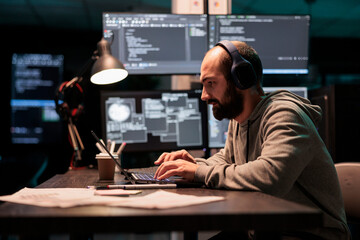 Software engineer typing code and creating algorithm for it startup company, writing html script on...