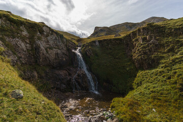 beautiful waterfall of small creek in Pyrenees Mountains, Col du Pourtalet, Nouvelle-Aquitaine France