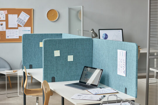 Background image of office interior with workplaces separated by partition walls, cubicles with desks, copy space