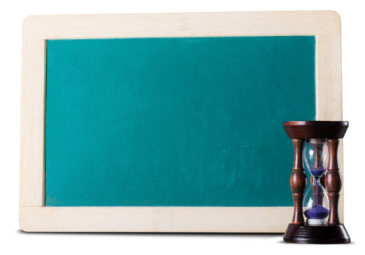 Old hourglass with empty wooden chalkboard