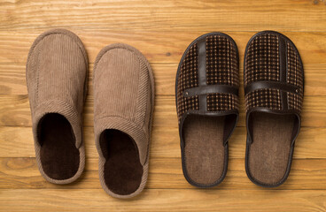 Man's slippers on wooden background, top view
