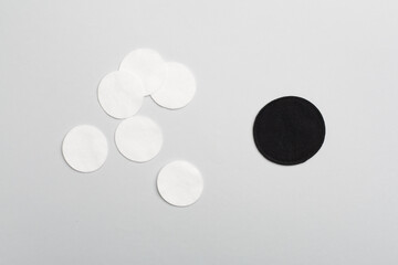 Reusable cotton pads with disposable ones on color background, top view