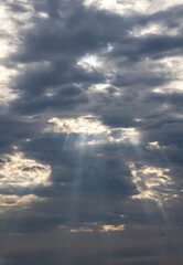 sun beams through cloudy sky