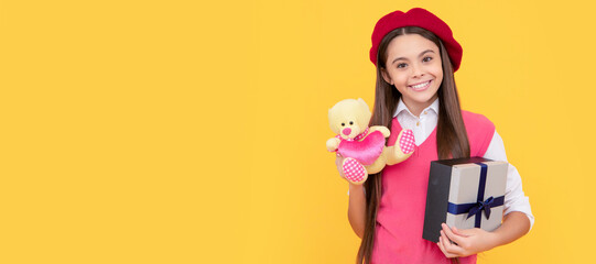 boxing day. kid in beret with toy. smiling child has birthday. teenage beauty go shopping. Kid girl with gift, horizontal poster. Banner header with copy space.