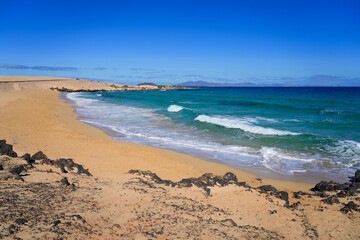 Moro beach in the Corralejo Natural Park in the north of Fuerteventura island in the Canaries, Spain - Waves in the Atlantic Ocean in winter