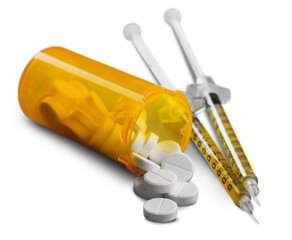 Drug abuse concept and two heroin syringes