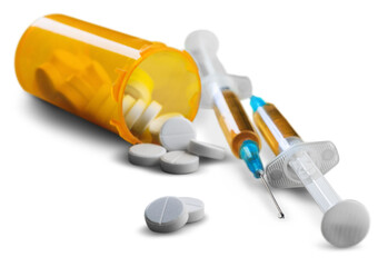 Drug abuse concept and two heroin syringes