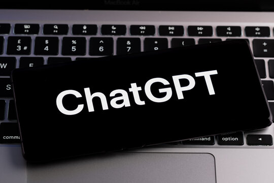 ChatGPT logo seen on smartphone placed on laptop keyboard. AI chatbot by OpenAI. Stafford, United Kingdom, December 20, 2022.
