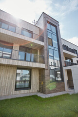 Wide angle shot of modern apartment building with lens flare